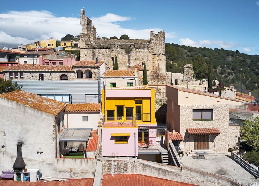 Ca la Carolina integrated into the historic village fabric through contemporary rural house renovation.