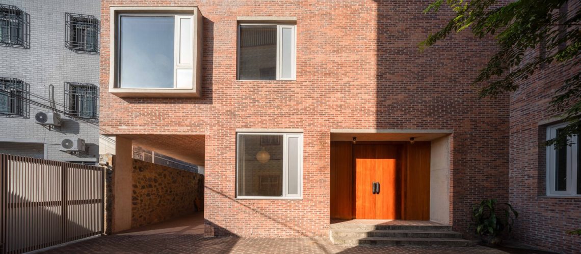 brick house light well interior with vertical light and shadow