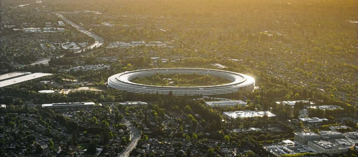 Apple architecture showcasing glass facades, natural light, and minimalist spatial design