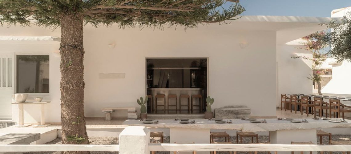 YAPA Antiparos courtyard restaurant blending Cycladic architecture, natural stone and Mediterranean landscape in Greece
